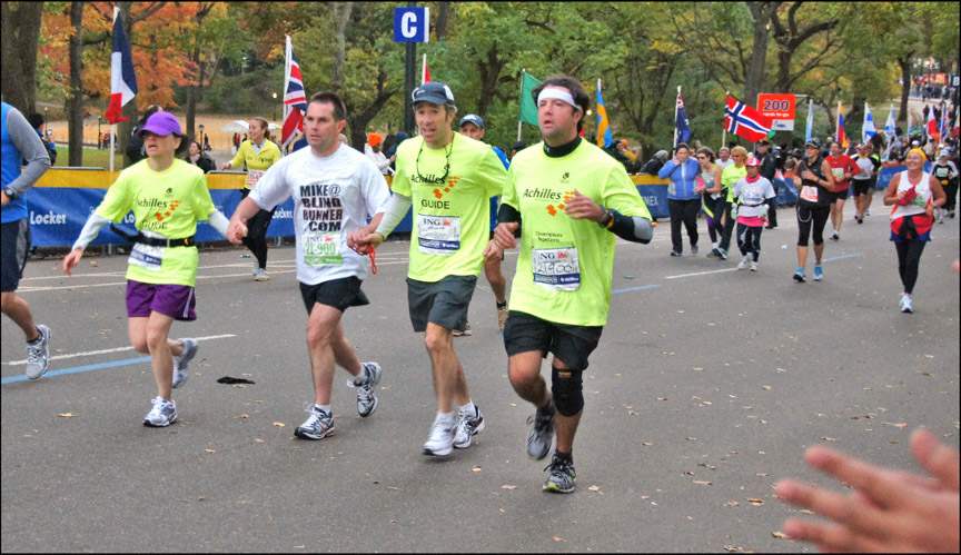 Mike and guide team running up to the finish line of the 2011 New York City Marathon. Photo provided by Lawrence White