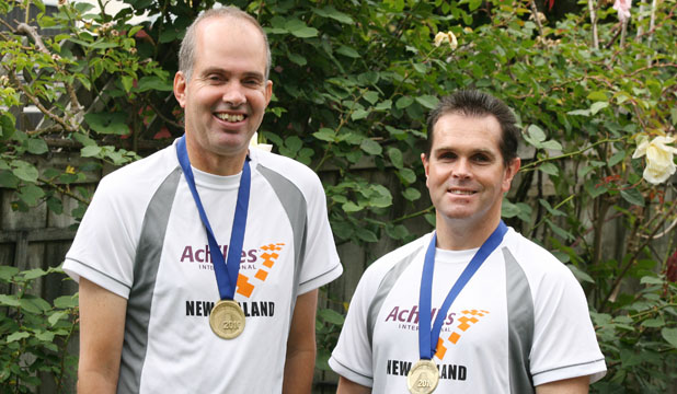 Mike and Martin wearing medals. - Photo by Ben Watson